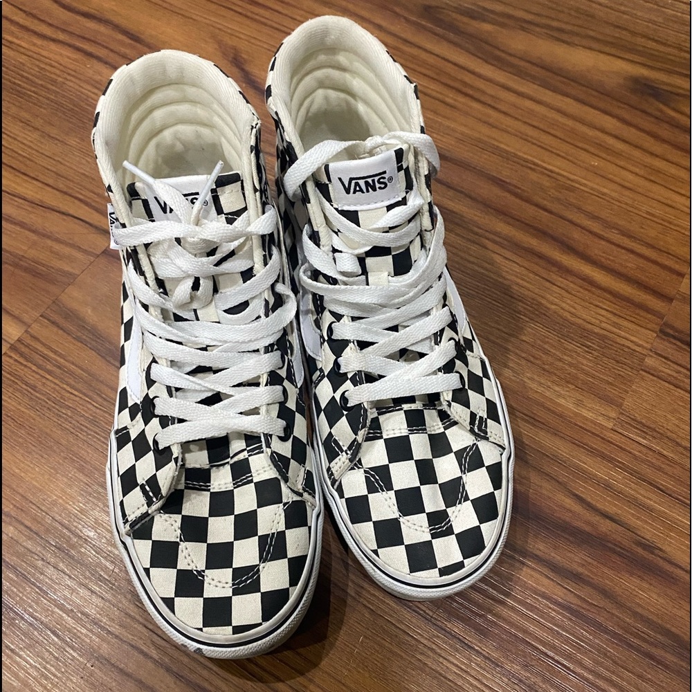 Black & White Vans Checkered High Top Vans.